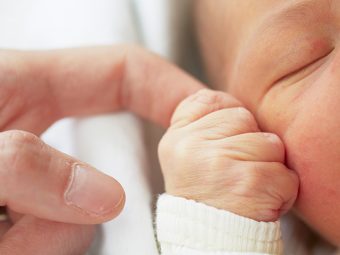 Why & When Your Newborn Holds On To Your Finger