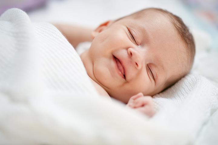 Why Do Babies Smile In Their Sleep?