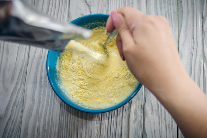 Add formula or breast milk to prepare rice cereal for babies