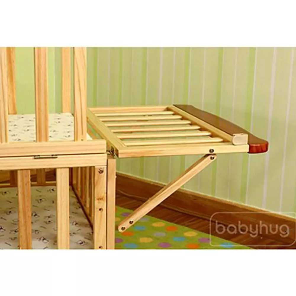 wooden cot with mosquito net