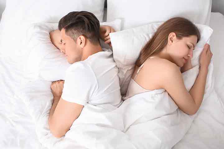 This is one of the most affectionate and cozy sleeping positions for a couple. In this position, the couple coils their arms and legs around each other, indicating they don’t want to get separated. Partners sleeping in this position are known to have intense emotions to share. Also, the position shows that the couple is highly dependent on one another. However, the indications might differ from one couple to another.