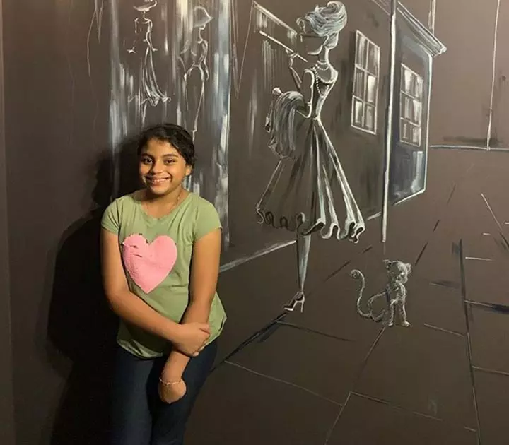 Alisah who was given the title 'Adopting a child from the orphanage