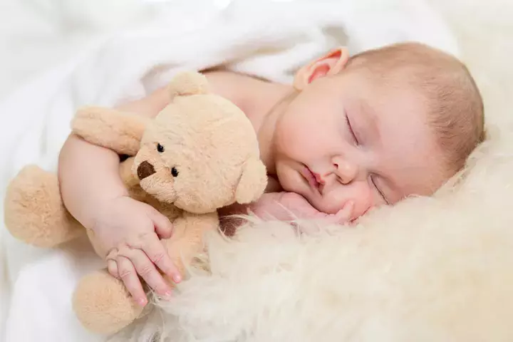 Placing Toys In Baby's Bed