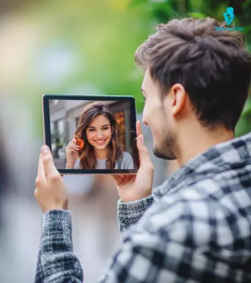 A woman is laughing after sending an intimate question over a text