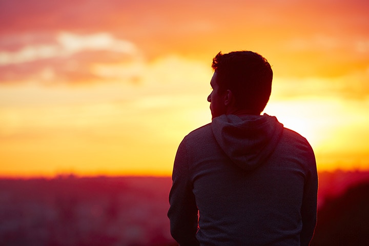 man watching sunset alone with loneliness quotes