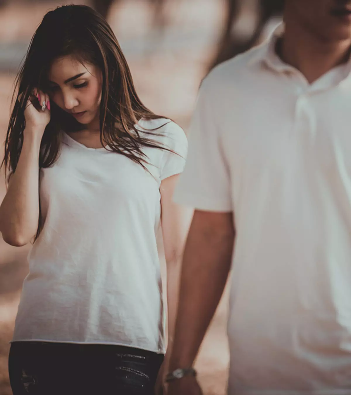 A girl crying after a men pull away