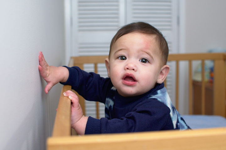 A sleepy baby may repeatedly bang its head against the crib