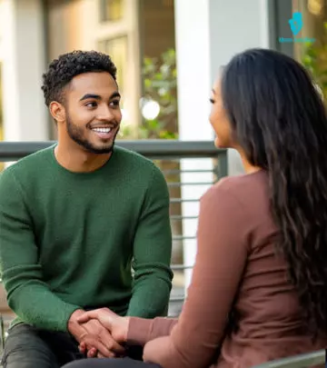 A woman is laughing after sending an intimate question over a text