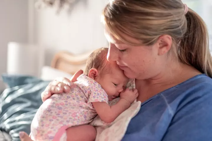 Rubbing baby's back can stop them from arching their back