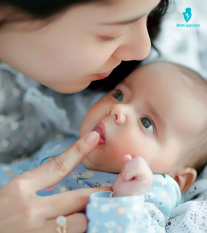 Baby SLeeping On Mother With Lip Quivers