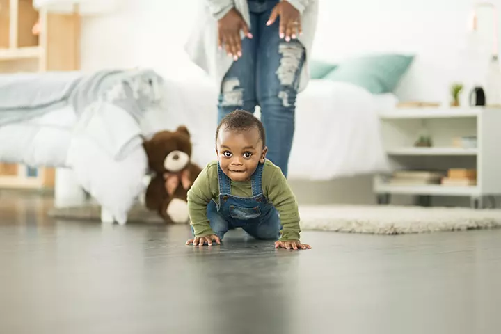 Crawling and scooting on the floor.