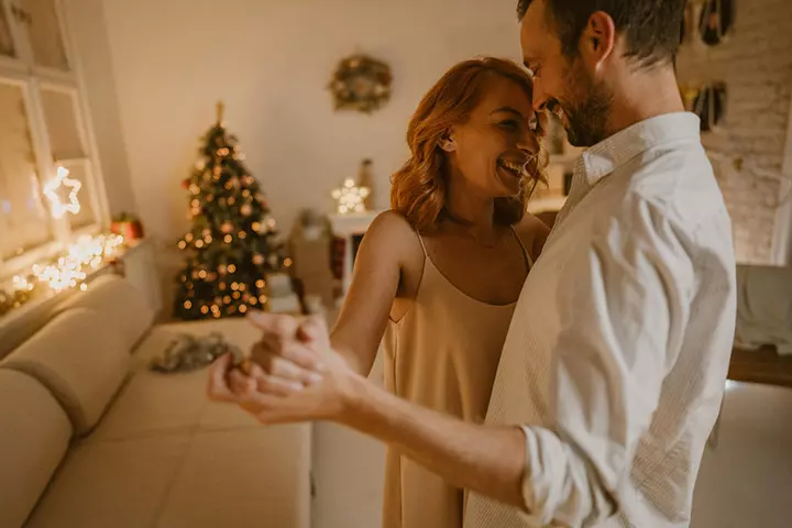 Dancing together on Christmas couple photo pose ideas