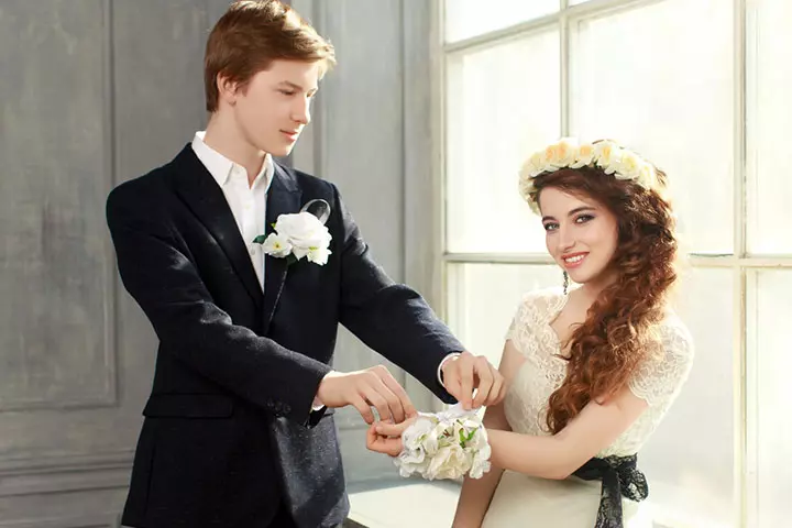 Man tying the corsage