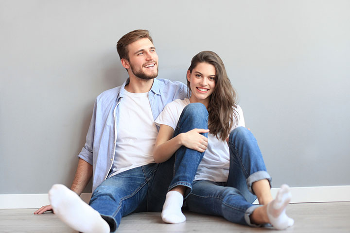 cute wedding couple in the interior of a classic studio posing at the sofa  . hey kiss and hug each other, holding hands looking at each other Stock  Photo | Adobe Stock