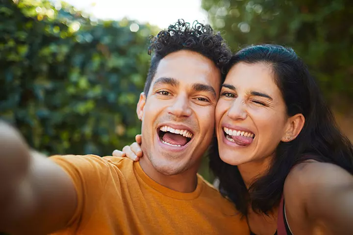 Teasing the camera couple photo pose ideas