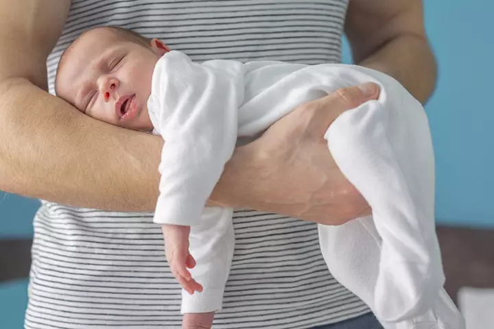 How to hold a baby in belly position