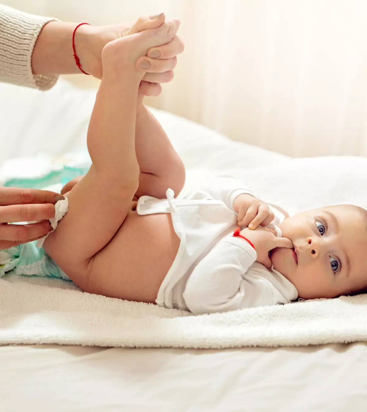 Mom Cleaning Baby's Balck Poop