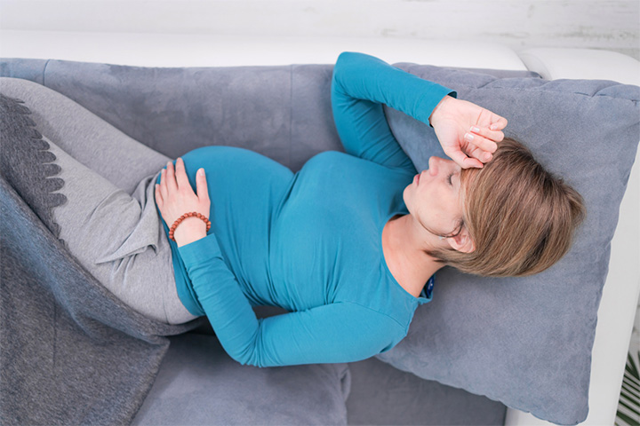 Sleeping on your back during pregnancy may cause nausea and morning sickness