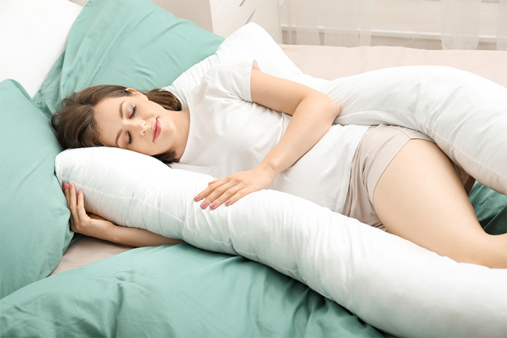 Use pillows and cushions to get into a comfortable sleeping position