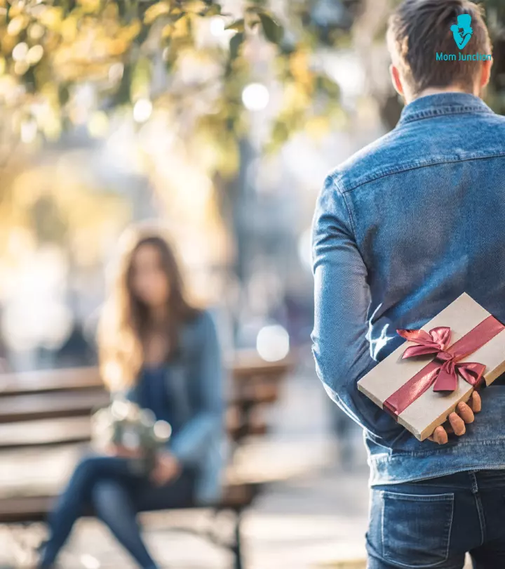 Guy Holding A Gift To Surprise His Girlfriend