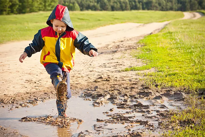 Kids exploring and playing in the mud