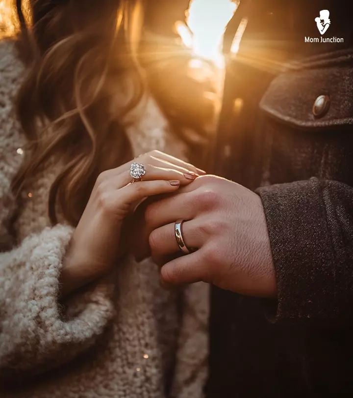 A couple is making love, posing with their hands