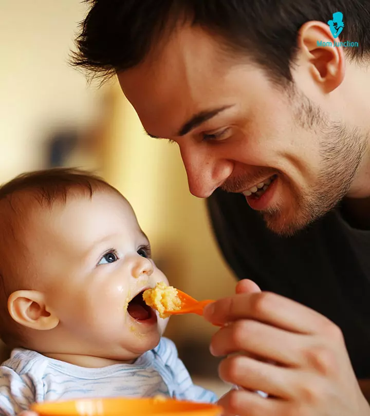 Father Feeding Semolina To Baby