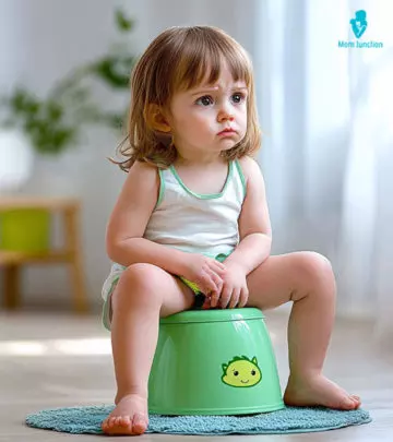 A Mom Checking COlor Of Baby Poop