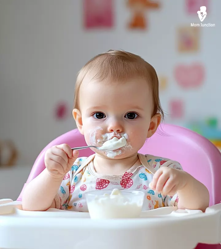 Baby Eating Bowl Of Yogurt