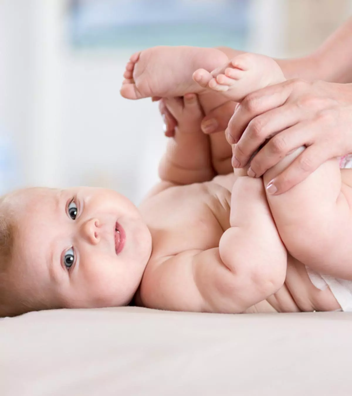 Mom performing some exercise on her baby