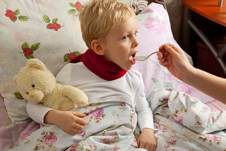 Child consuming medicine 