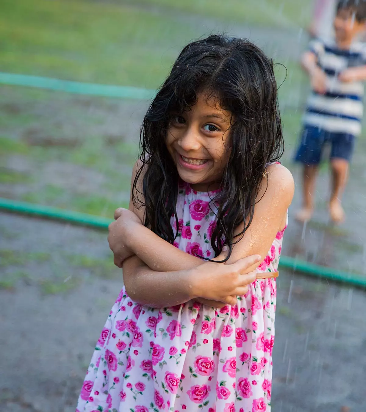 A small girl enjoying the monsoon