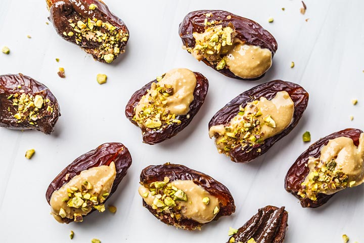 Pitted dates stuffed with peanut butter and walnuts