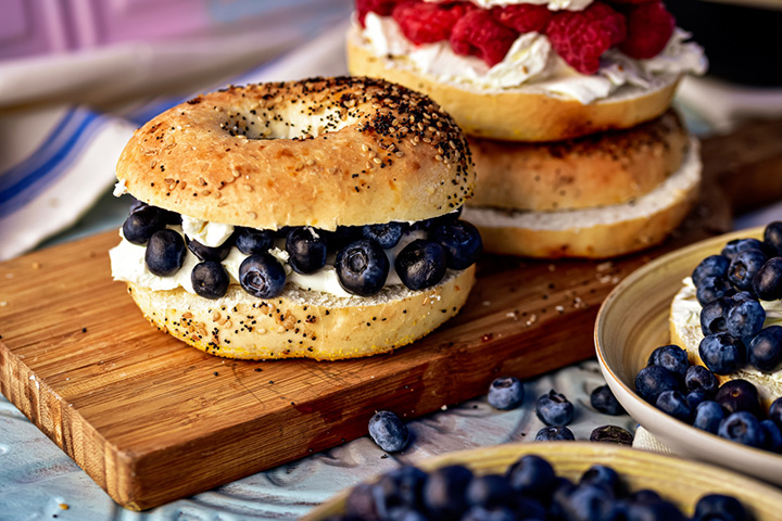 Blueberry cream bagel sandwich with nuts and Greek yogurt, school lunch idea for kids
