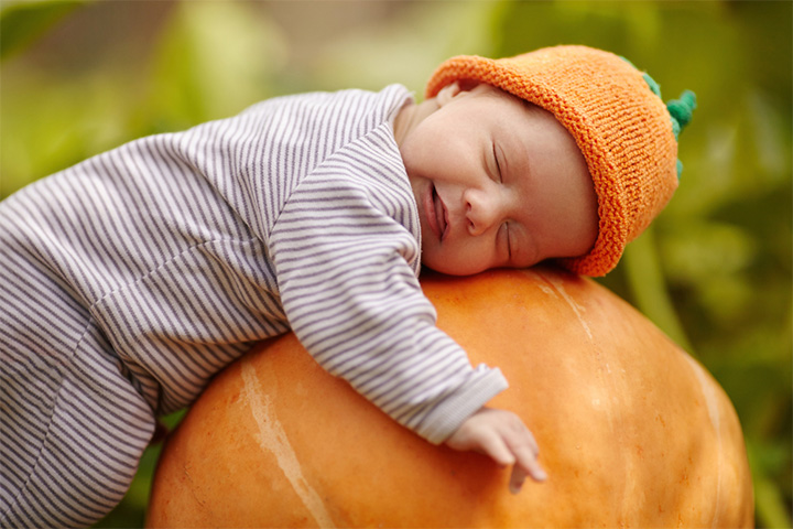 Cute little sleeping baby in a pumpkin pictures