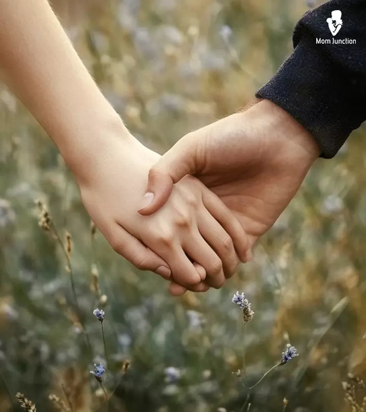 A couple holds their hand