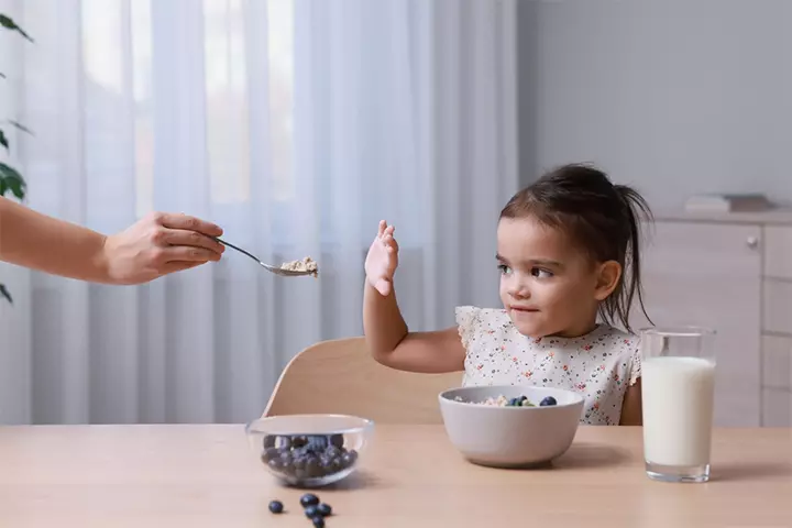 Appetite dip can be a sign of toddler holding poop