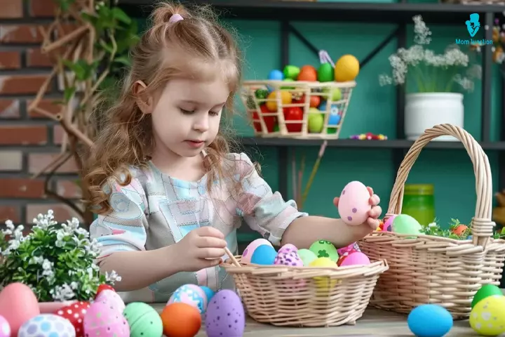 Child preparing an easter basket