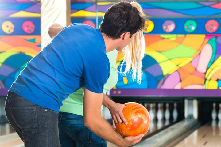 Couples enjoying bowling