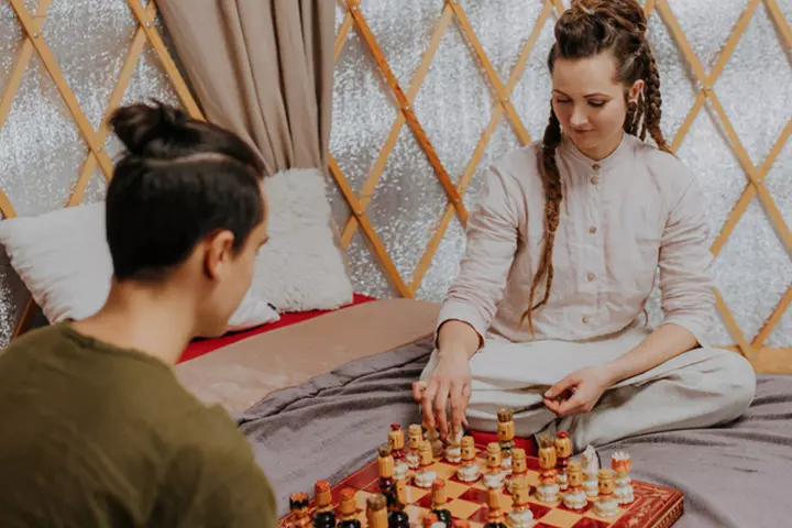 Couples playing a board game