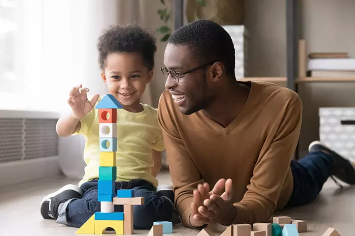 Dad playing blocks with son