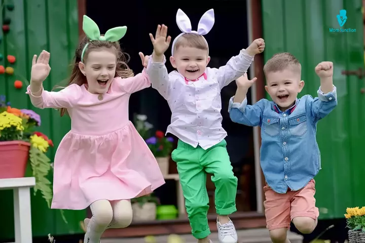 Kids dressed as Easter bunnies and hopping