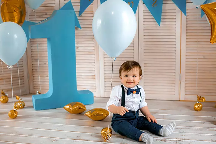 1st birthday photoshoot ideas with a number-one balloon