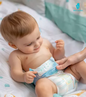 A Mom Checking COlor Of Baby Poop