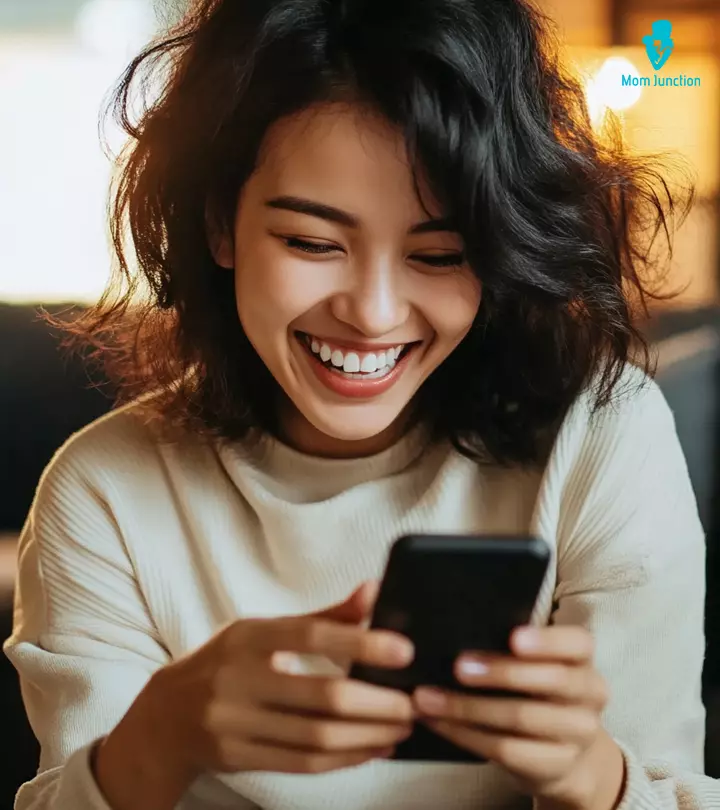 A Woman Playing Texting Game With Friend On Phone