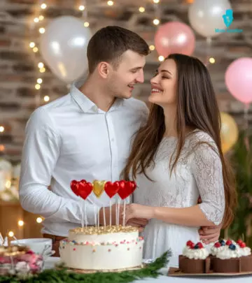 A guy holds his girlfriend on the shoulder