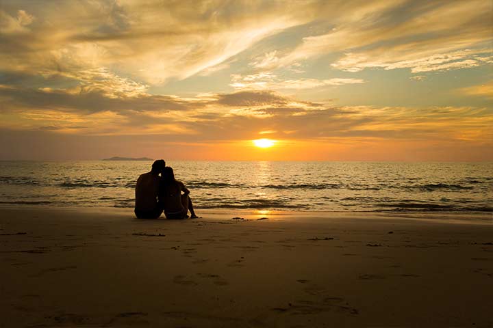 Couple watching sunset, good evening message