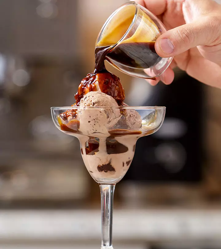 Pouring chocolate syrup on icecreams