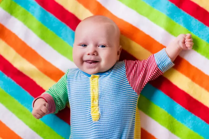 smiling-baby-boy-bed-laughing-child