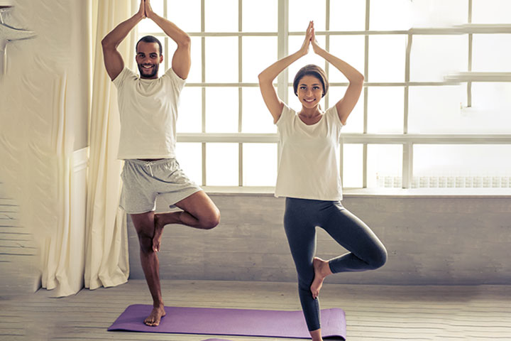 Couple practicing yoga together